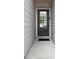 A well-lit front entrance with a gray door featuring a glass pane, offering a welcoming entry to the home at 6780 Cedar Glen Rd, Peachtree Corners, GA 30360