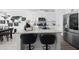 Modern kitchen island with granite countertops, seating, and stainless steel appliances, perfect for dining and entertaining at 6780 Cedar Glen Rd, Peachtree Corners, GA 30360