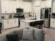 Bright kitchen with white cabinets, granite counters, and stainless steel appliances opens to the living room at 6780 Cedar Glen Rd, Peachtree Corners, GA 30360
