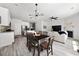 Open-concept space featuring a modern dining area, spacious living room, and a well-equipped kitchen at 6780 Cedar Glen Rd, Peachtree Corners, GA 30360