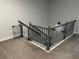 Upstairs landing with gray wood trim and black iron spindles at the top of the stairs at 6780 Cedar Glen Rd, Peachtree Corners, GA 30360