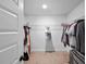 Clean and spacious walk-in closet with ample hanging space and wire shelving at 6780 Cedar Glen Rd, Peachtree Corners, GA 30360