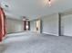 A spacious bonus room featuring plush carpeting, modern lighting, and three windows with view at 1020 Broadview Dr, Marietta, GA 30062