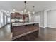 Modern kitchen with stainless steel appliances, dark wood cabinets, and a gray countertop island at 1020 Broadview Dr, Marietta, GA 30062