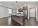 Modern kitchen features a large center island, stainless steel appliances and hardwood floors at 1020 Broadview Dr, Marietta, GA 30062