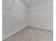 Walk-in closet featuring carpet and metal shelving perfect for storage solutions at 1020 Broadview Dr, Marietta, GA 30062