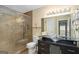 Modern bathroom featuring a glass shower, a vessel sink, and neutral tile at 3192 Paces Mill Rd, Atlanta, GA 30339