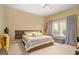 Comfortable bedroom features soft carpet, large window with lots of natural light, and stylish decorative accents at 3192 Paces Mill Rd, Atlanta, GA 30339