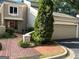 Charming two-story home with a brick driveway, a two-car garage, and mature landscaping at 3192 Paces Mill Rd, Atlanta, GA 30339