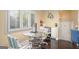Bright home office nook featuring a glass desk, shuttered windows, and hardwood floors at 3192 Paces Mill Rd, Atlanta, GA 30339