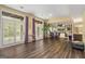 Spacious living area with hardwood floors, large windows, and a dining area at 3192 Paces Mill Rd, Atlanta, GA 30339