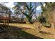 Spacious yard with a wooden fence and mature trees at 3224 Canary Ct, Decatur, GA 30032
