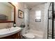 Bathroom features a shower-tub combo, marble tile, and updated fixtures at 3224 Canary Ct, Decatur, GA 30032