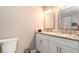 Renovated bathroom with double vanity and granite counters at 3224 Canary Ct, Decatur, GA 30032