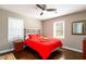 Bedroom featuring a ceiling fan, wood floors, and ample light at 3224 Canary Ct, Decatur, GA 30032