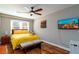 Comfortable bedroom with hardwood floors, TV, and natural light at 3224 Canary Ct, Decatur, GA 30032