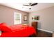 Comfortable bedroom with modern ceiling fan, television, and hardwood floors at 3224 Canary Ct, Decatur, GA 30032