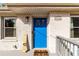 Front porch featuring a bright blue door, new welcome mat, and house numbers at 3224 Canary Ct, Decatur, GA 30032