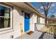 Inviting front porch with painted railing, bright blue door, welcome mat, and a painted brick exterior at 3224 Canary Ct, Decatur, GA 30032