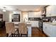 Kitchen featuring modern appliances, granite countertops, and sleek white cabinets with black backsplash at 3224 Canary Ct, Decatur, GA 30032