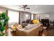 Cozy living room with large windows, ceiling fan, and access to dining area at 3224 Canary Ct, Decatur, GA 30032