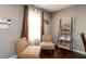 Cozy sitting area with decorative shelving and natural light from the bright window at 3224 Canary Ct, Decatur, GA 30032