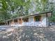 A view of the home's backyard and surrounding trees at 221 Wonewok Dr, Canton, GA 30114