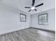 Bright bedroom with new windows, hardwood floors, a ceiling fan, and neutral paint at 221 Wonewok Dr, Canton, GA 30114