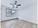 Bright, airy bedroom featuring hardwood floors, a ceiling fan, and natural light at 221 Wonewok Dr, Canton, GA 30114