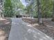 View of the home showcasing a long driveway at 221 Wonewok Dr, Canton, GA 30114