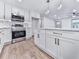 Spacious modern kitchen featuring an island, stainless steel appliances, and lots of natural light at 221 Wonewok Dr, Canton, GA 30114