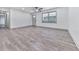 Open-concept living room with hardwood floors, a ceiling fan, and modern finishes at 221 Wonewok Dr, Canton, GA 30114