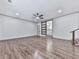 Spacious living room features hardwood floors, recessed lighting, and a sliding barn door at 221 Wonewok Dr, Canton, GA 30114