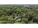 An aerial view shows a secluded home nestled among trees, offering privacy and natural beauty at 320 Shady Grove Ln, Alpharetta, GA 30009