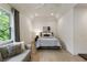 Bright bedroom features a vaulted ceiling, hardwood floors, and natural light from a large window at 320 Shady Grove Ln, Alpharetta, GA 30009