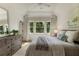 Comfortable bedroom with neutral tones, ceiling fan, and plenty of natural light at 320 Shady Grove Ln, Alpharetta, GA 30009