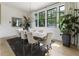 Formal dining room with large windows, chandelier, and a spacious table for entertaining at 320 Shady Grove Ln, Alpharetta, GA 30009