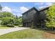 Beautiful two-story home with a two-car garage, well-manicured lawn, and professionally landscaped front yard at 320 Shady Grove Ln, Alpharetta, GA 30009