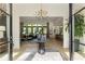 Inviting foyer with elegant chandelier, decorative table, and open view into the living room at 320 Shady Grove Ln, Alpharetta, GA 30009