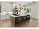 Modern kitchen with a large island, pendant lighting, and ample cabinet space at 320 Shady Grove Ln, Alpharetta, GA 30009