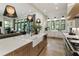 Open kitchen featuring a large island, marble countertops, and stainless steel appliances at 320 Shady Grove Ln, Alpharetta, GA 30009
