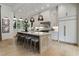 Bright, modern kitchen featuring a large island with seating, white cabinetry, and stainless steel appliances at 320 Shady Grove Ln, Alpharetta, GA 30009