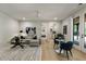 Large living room with hardwood floors features comfortable seating and lots of natural light at 320 Shady Grove Ln, Alpharetta, GA 30009