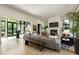 Spacious living area with a fireplace, modern furniture, and a seamless transition to the foyer at 320 Shady Grove Ln, Alpharetta, GA 30009