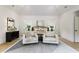 Spacious main bedroom with vaulted ceiling, sitting area, and natural light at 320 Shady Grove Ln, Alpharetta, GA 30009