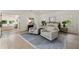 Bright and airy main bedroom with seating area and attached bathroom at 320 Shady Grove Ln, Alpharetta, GA 30009