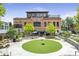 Outdoor dining at a brewery in a community gathering space with greenery and decorative trees at 320 Shady Grove Ln, Alpharetta, GA 30009