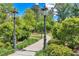 Scenic walking path with lush landscaping and elegant lamp posts create an inviting outdoor space at 320 Shady Grove Ln, Alpharetta, GA 30009