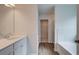 Bathroom with modern fixtures, bathtub and walk-in closet at 320 Tulip Dr, Covington, GA 30016