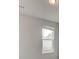 Bright and airy bedroom with neutral walls, a window with blinds, and a ceiling fan at 320 Tulip Dr, Covington, GA 30016